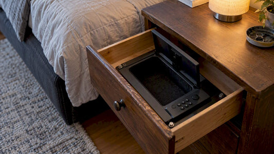 Mounted quick-access safe beside a bed