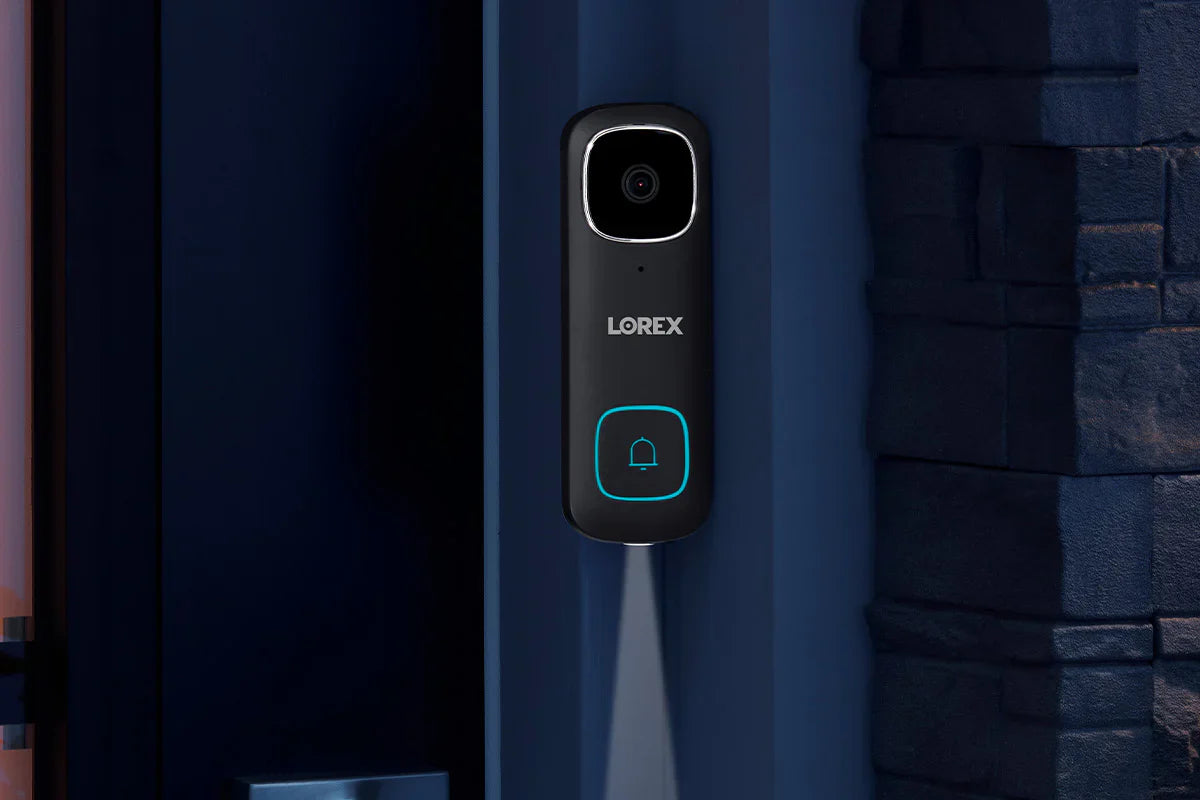Lorex doorbell on a blue door with stone wall background