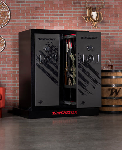 Winchester gun safe in a room with a brick wall and decorative elements.